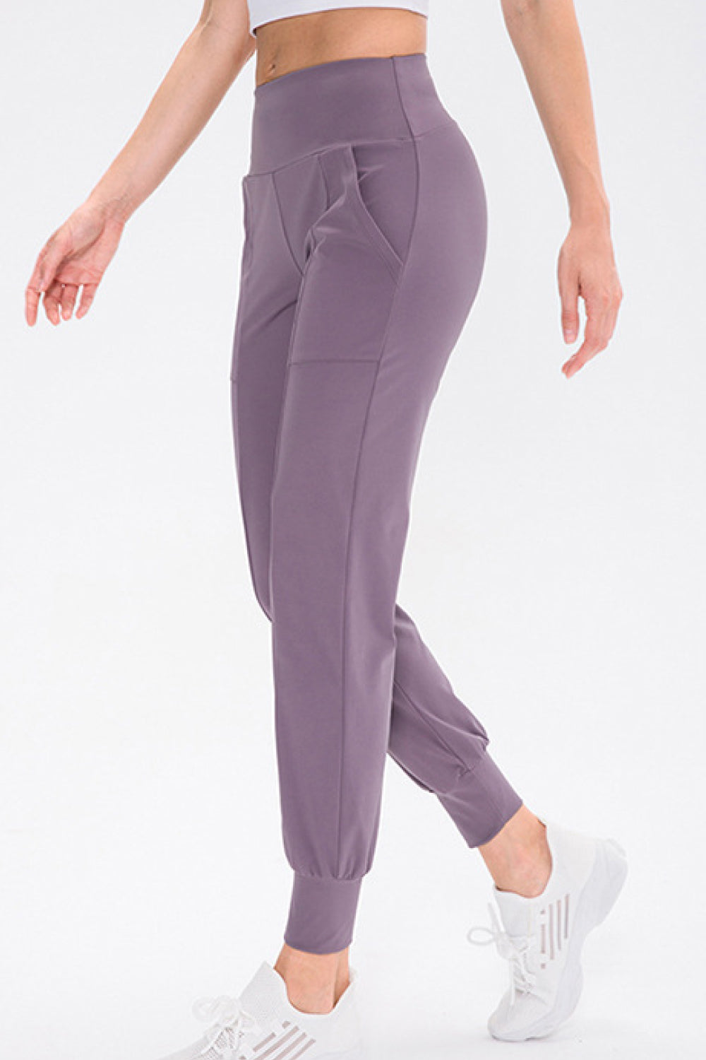 High Waist Joggers with Pockets in solid color, showcasing their stretchy fabric and stylish design.