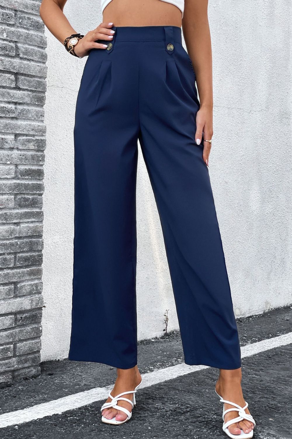 High-Rise Pleated Waist Wide Leg Pants in solid color, showcasing a stylish and minimalist design suitable for office wear.