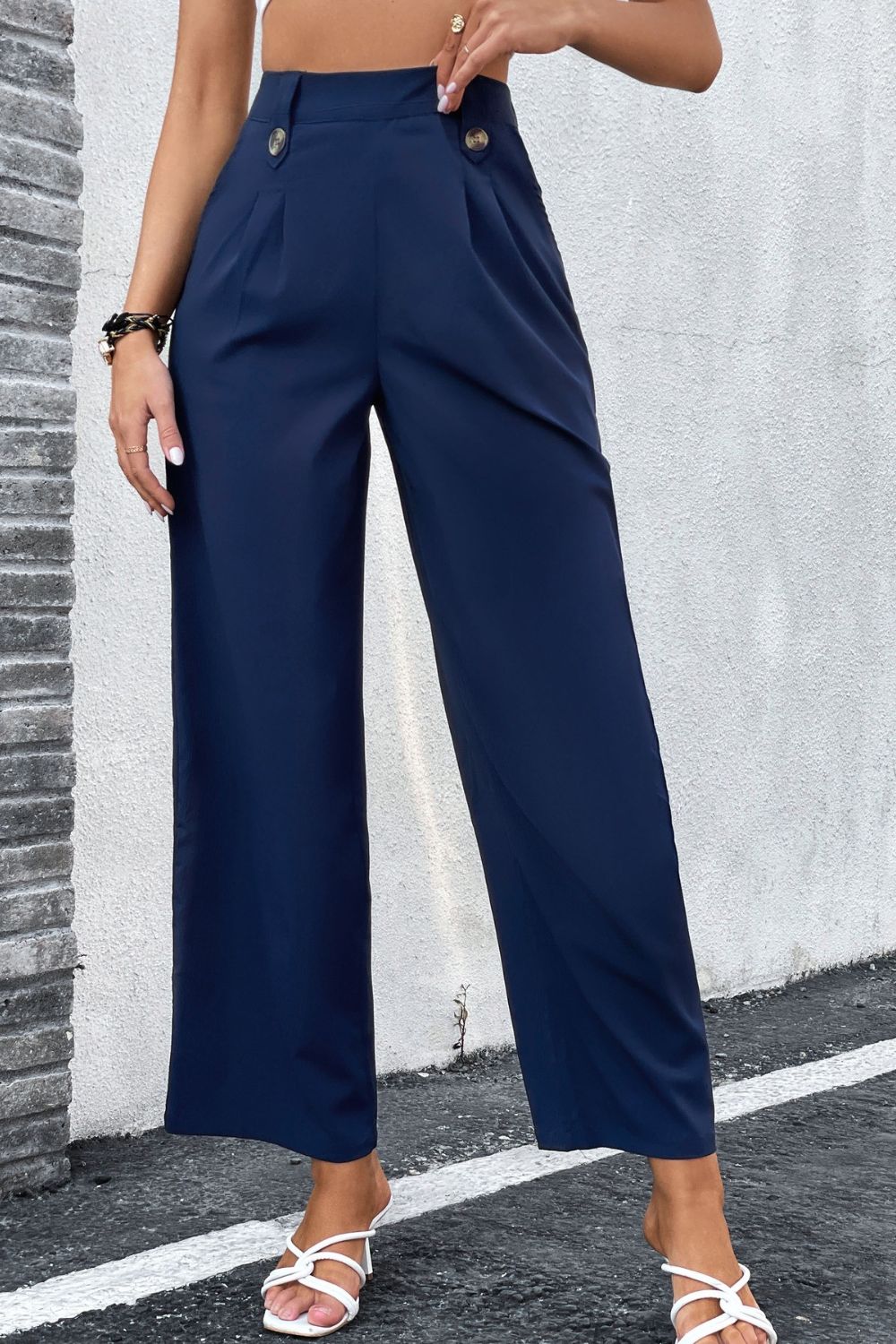 High-Rise Pleated Waist Wide Leg Pants in solid color, showcasing a stylish and minimalist design suitable for office wear.