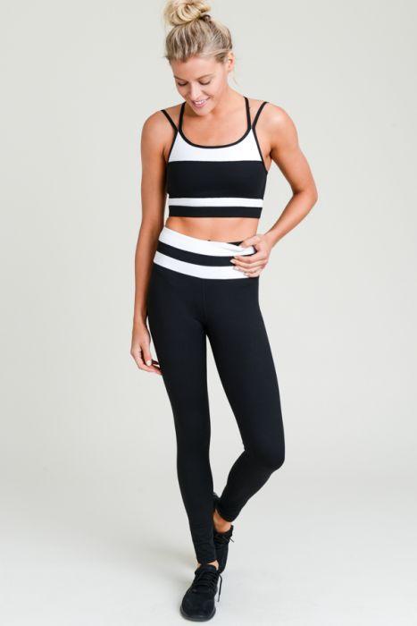 Highwaist black and white stripe full leggings with a hidden phone pouch, showcasing a stylish design and comfortable fit.
