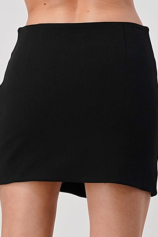 A stylish side zipper detail mini skirt displayed on a model, showcasing its trendy design and flattering fit.