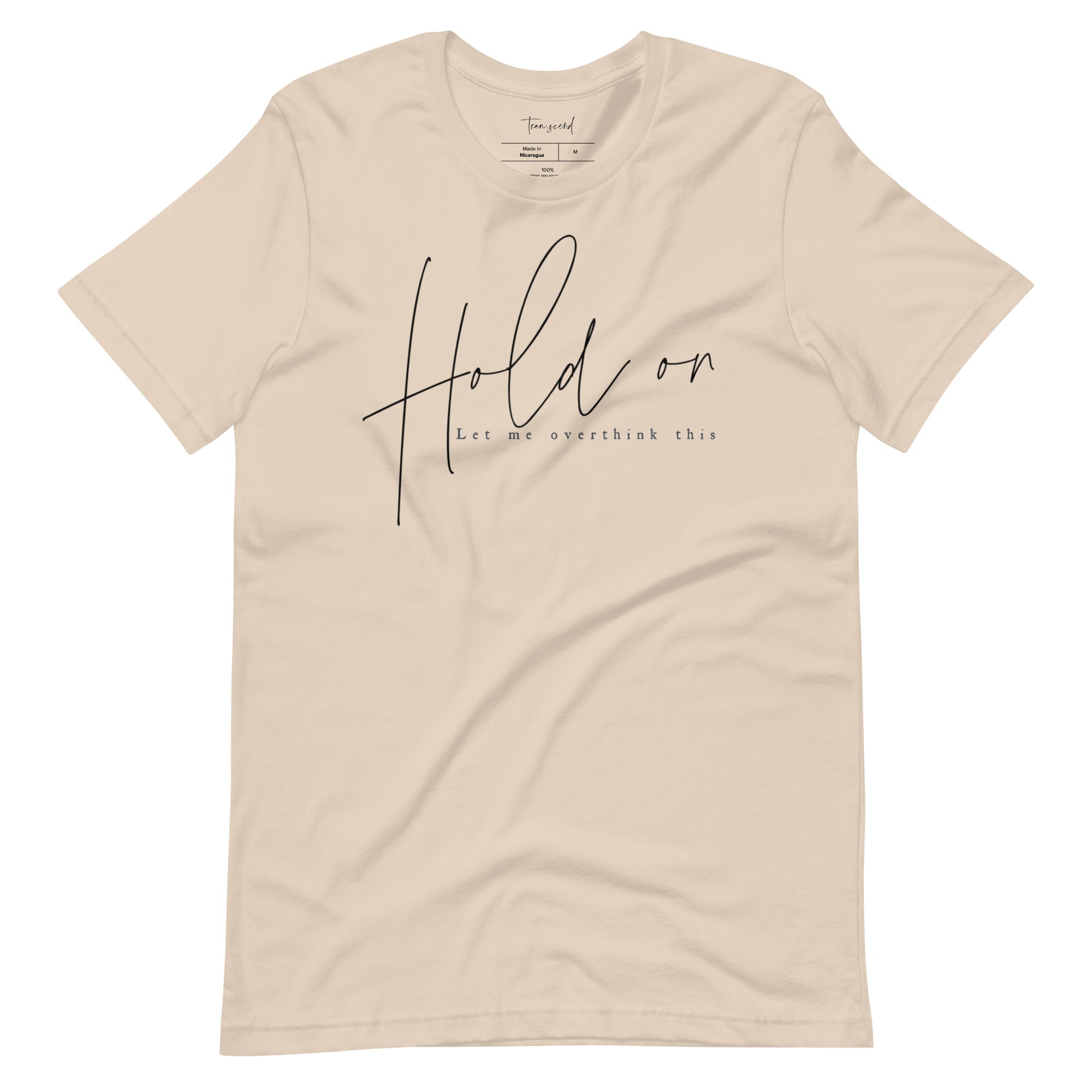 A soft and breathable unisex tee featuring the phrase 'Hold On Let Me Overthink This' in a stylish font, available in various colors.