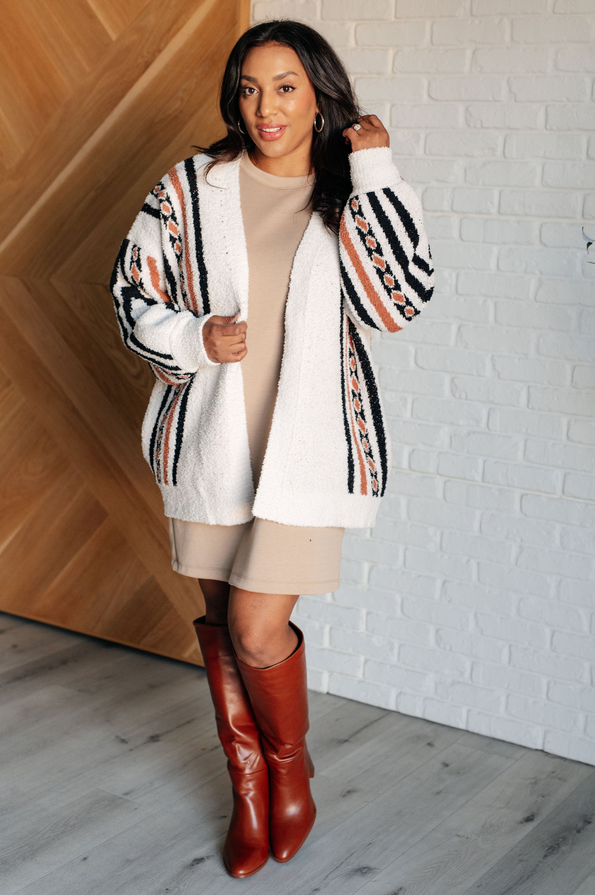 A cozy Holding On Aztec Print Cardigan featuring a vibrant Aztec design, open front, and dropped shoulder for a relaxed fit.