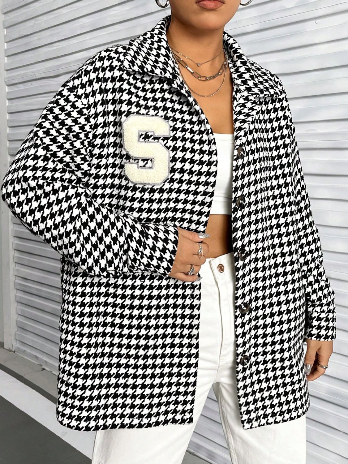 Houndstooth Button Down Long Sleeve Shacket featuring a classic pattern, button-down front, and long sleeves, made from a soft polyester and spandex blend.