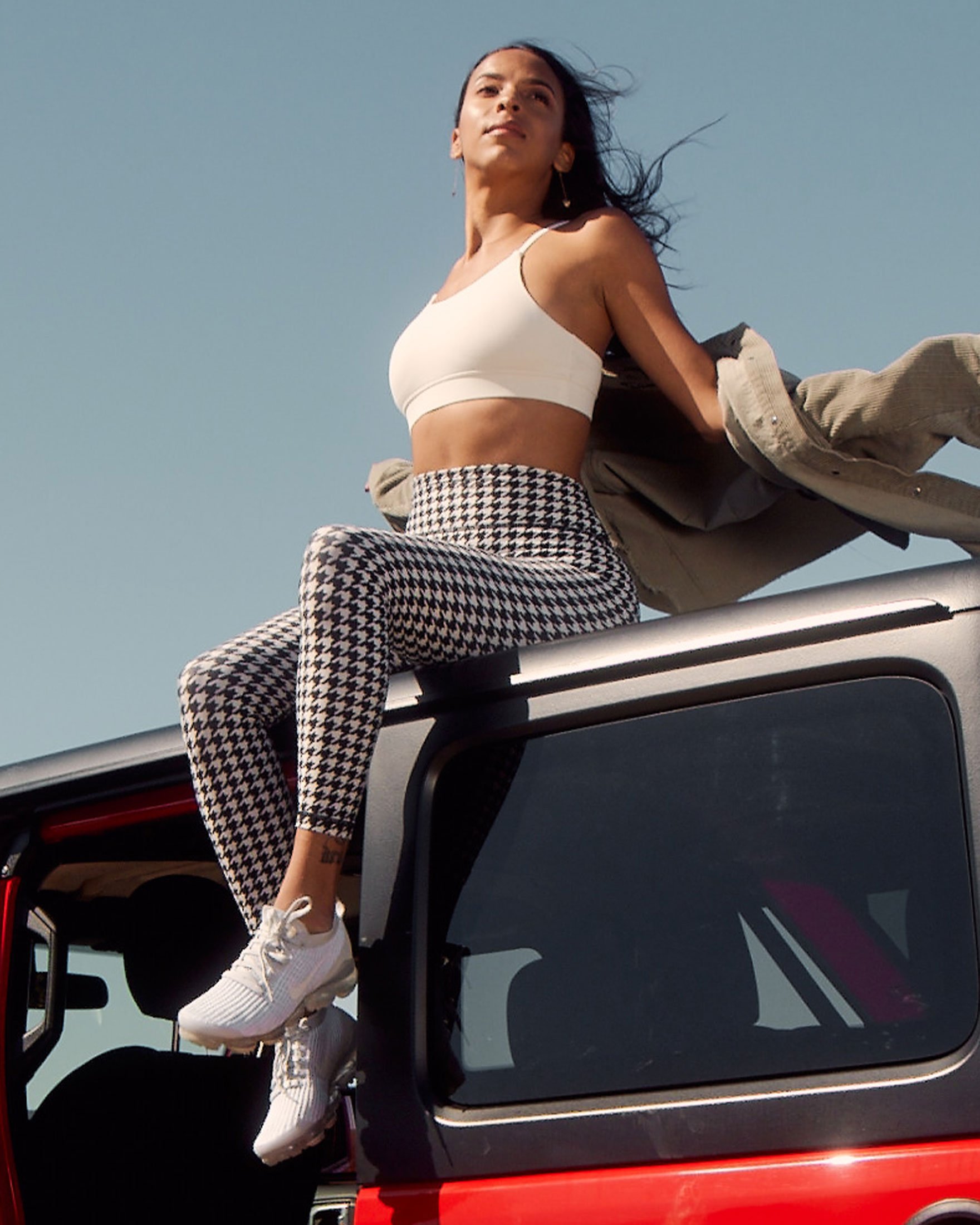 A pair of stylish high-waisted hybrid fleece leggings in houndstooth print, designed for comfort and warmth during workouts.