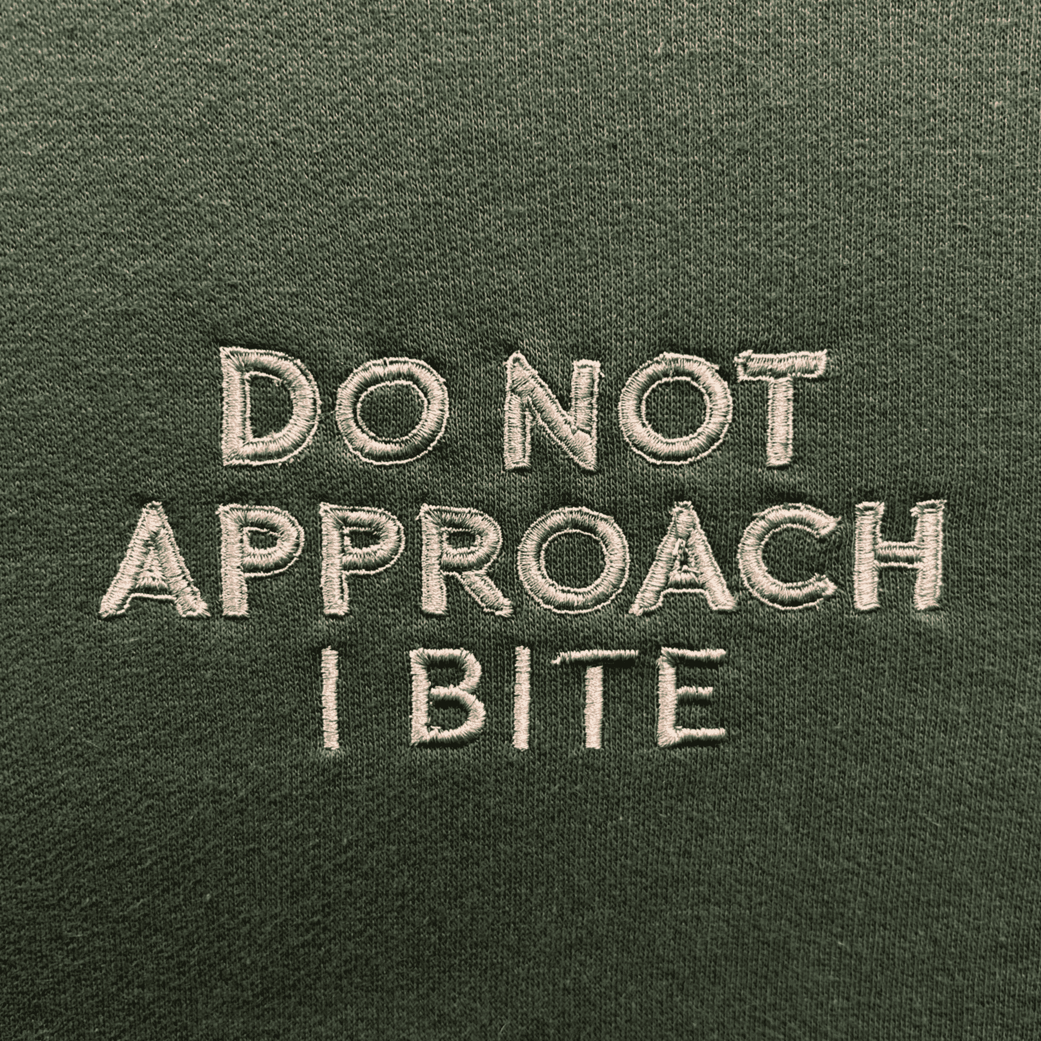 I Bite sweatshirt featuring stylish embroidery, crew neck, and long sleeves, made from comfortable cotton material.