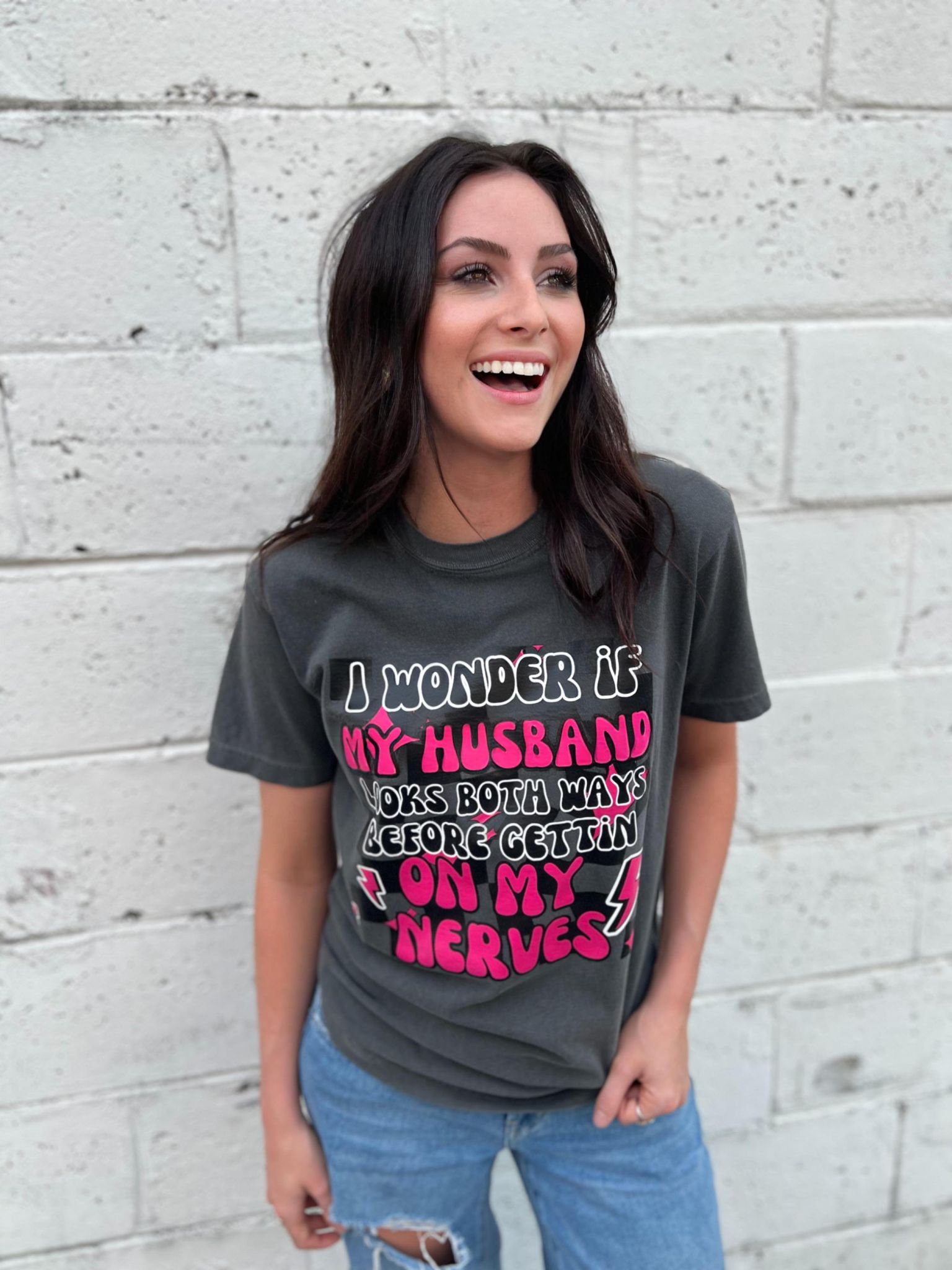 A fun and cute 'I Wonder if My Husband' tee in Pepper color, made from 100% cotton, showcasing its comfortable fit.