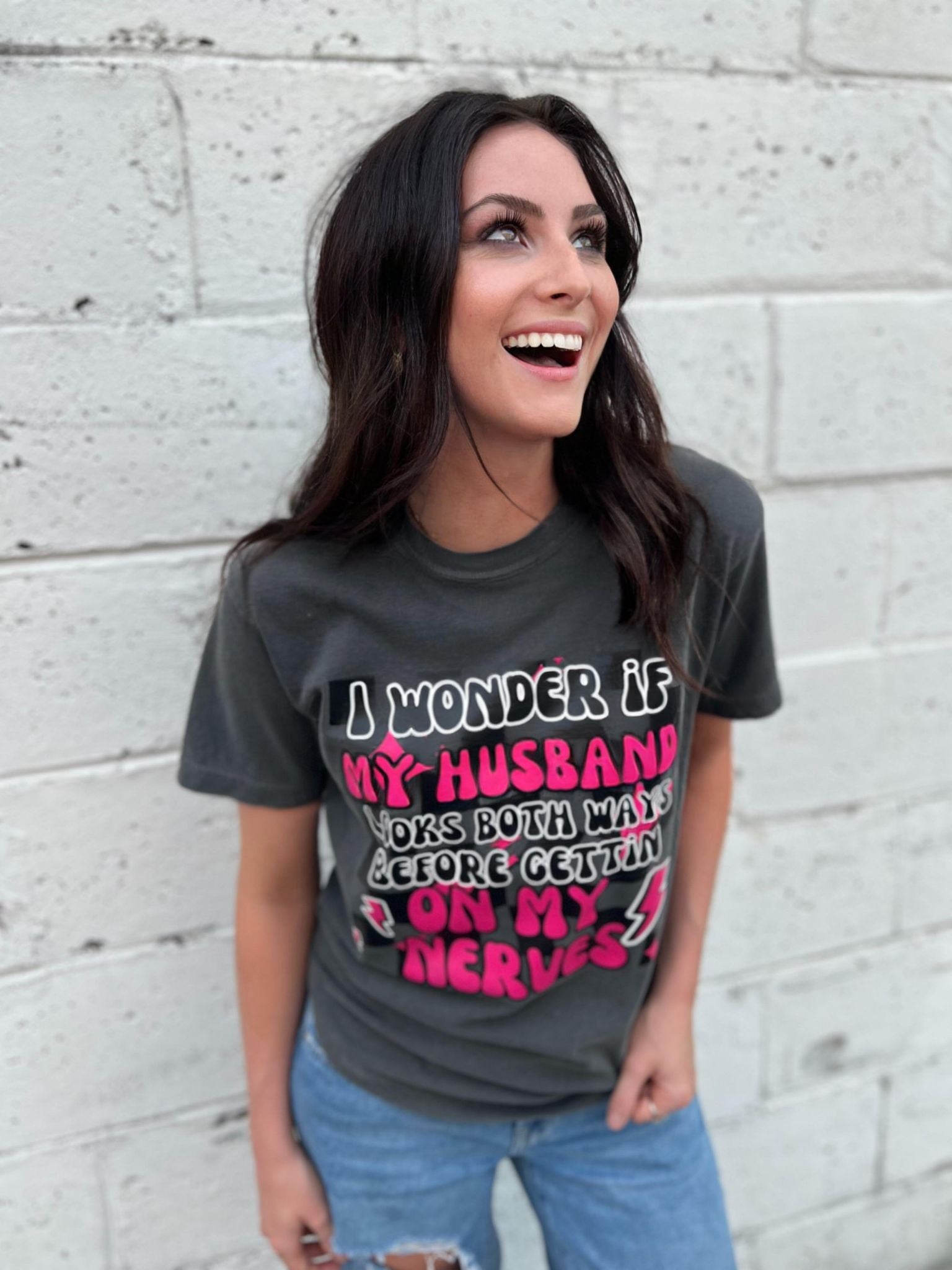 A fun and cute 'I Wonder if My Husband' tee in Pepper color, made from 100% cotton, showcasing its comfortable fit.