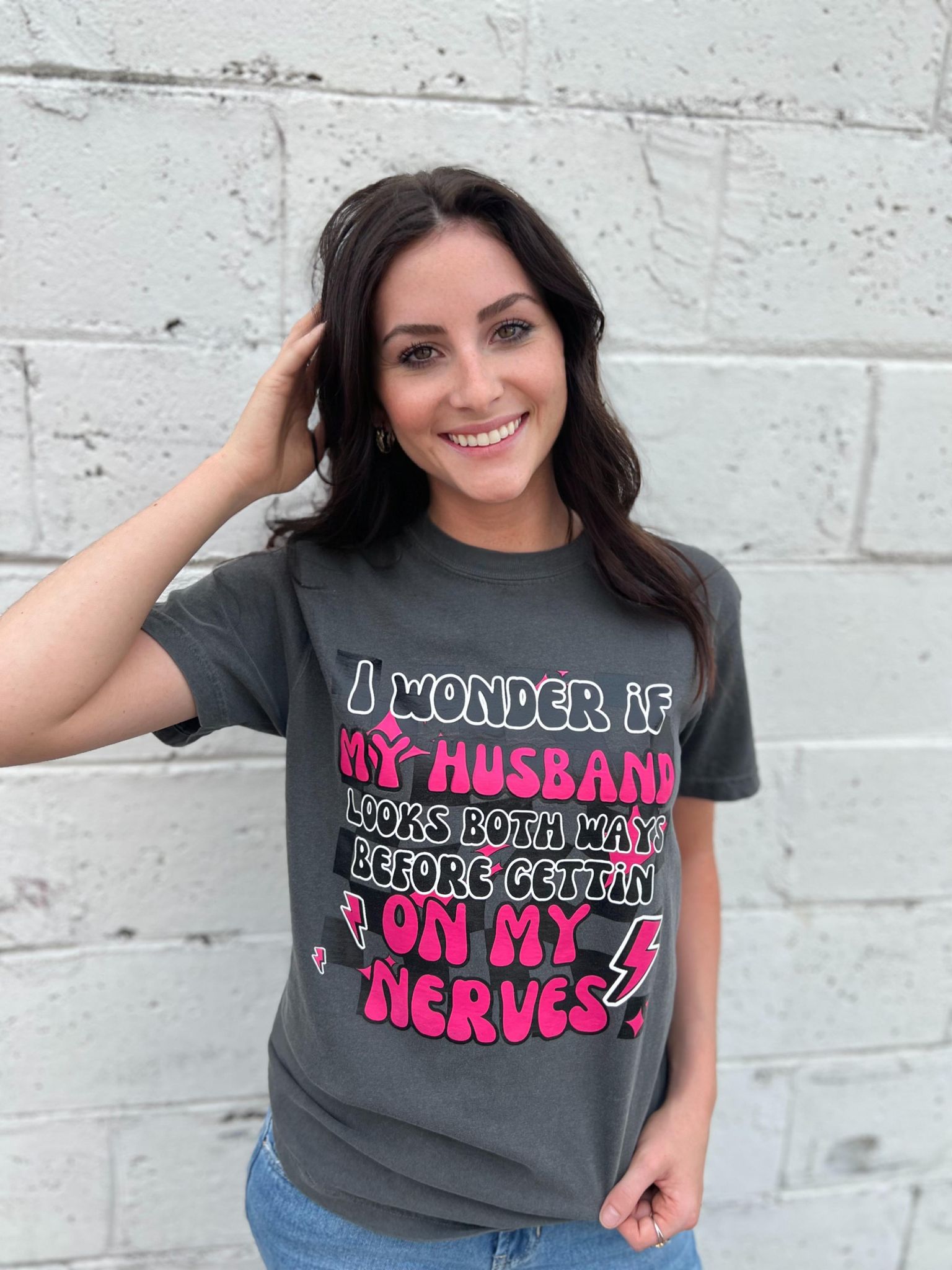 A fun and cute 'I Wonder if My Husband' tee in Pepper color, made from 100% cotton, showcasing its comfortable fit.