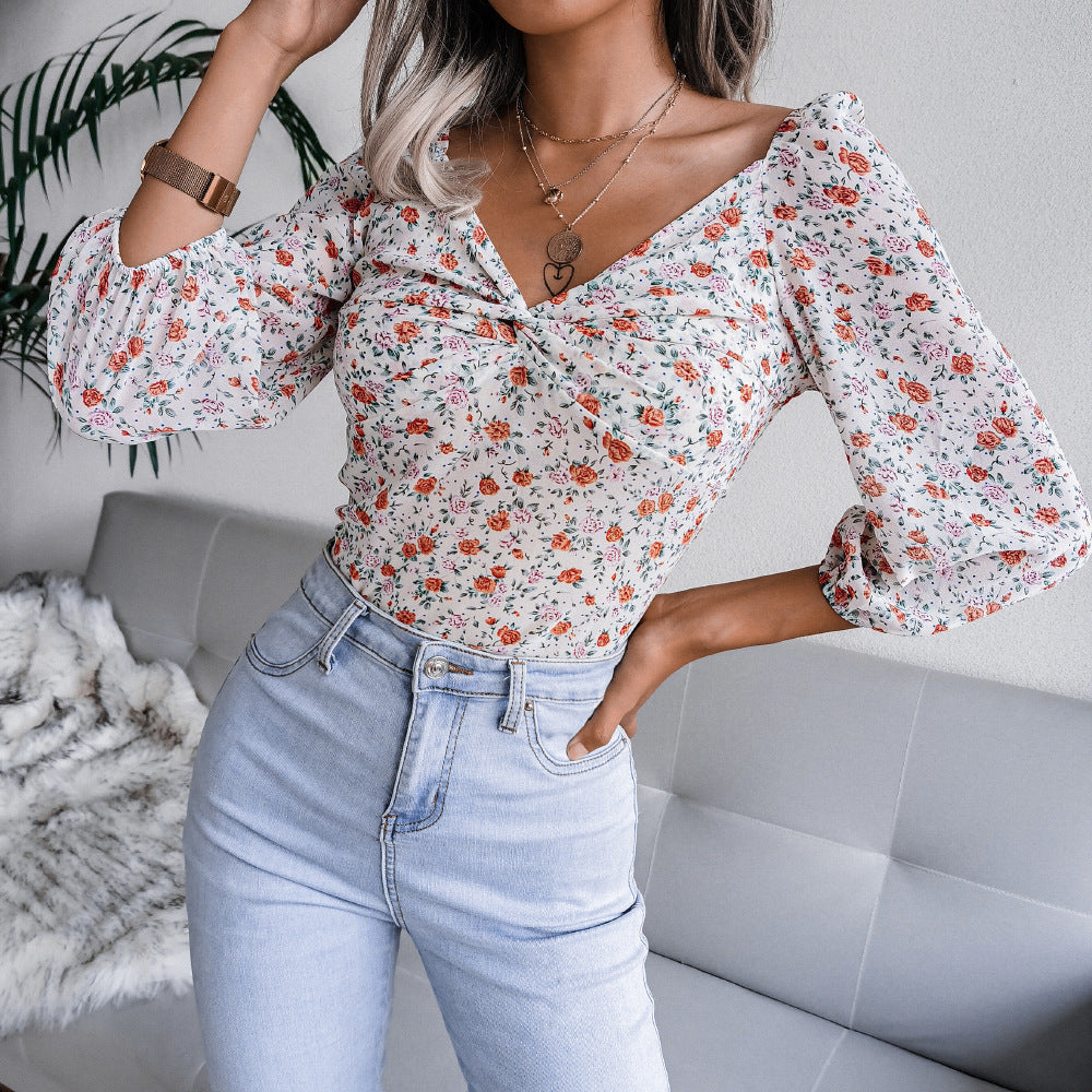 A stylish Ins Style Live Shot V-Neck Knotted Floral C top featuring a floral pattern, perfect for autumn and winter wear.