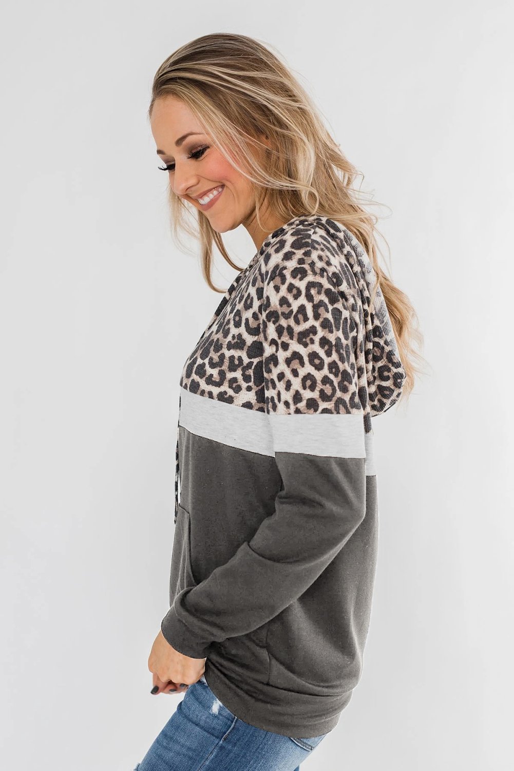 Into the Jungle Color Block Hoodie featuring a leopard design, lightweight fabric, and drawstring hood.