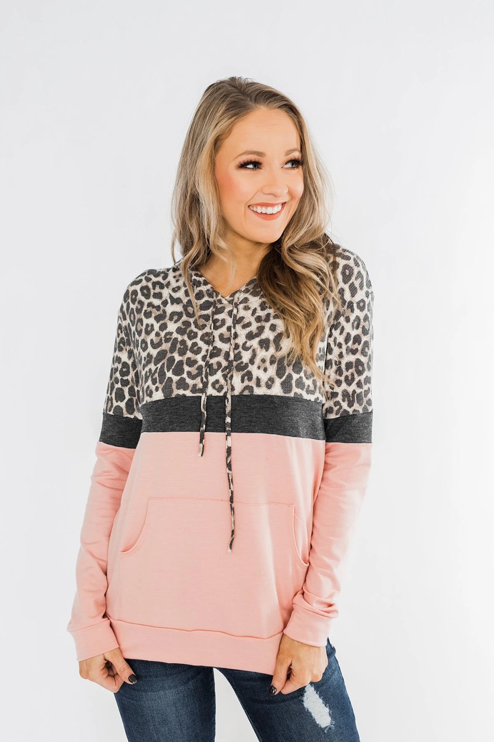 Into the Jungle Color Block Hoodie featuring a leopard design, lightweight fabric, and drawstring hood.