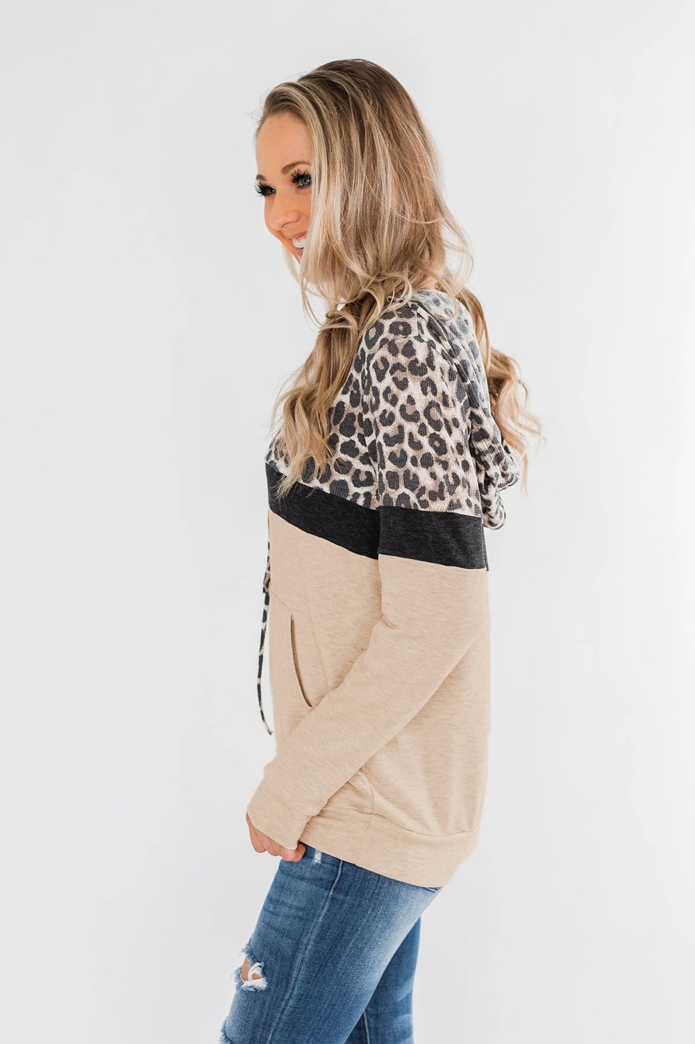 Into the Jungle Color Block Hoodie featuring a leopard design, lightweight fabric, and drawstring hood.