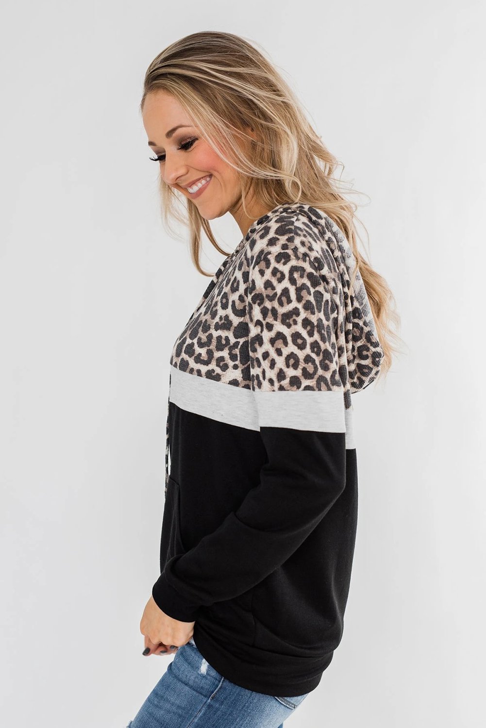 Into the Jungle Color Block Hoodie featuring a leopard design, lightweight fabric, and drawstring hood.