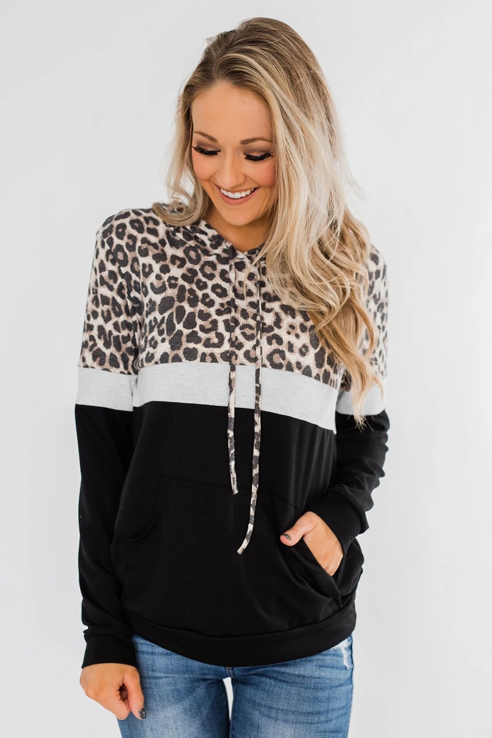 Into the Jungle Color Block Hoodie featuring a leopard design, lightweight fabric, and drawstring hood.