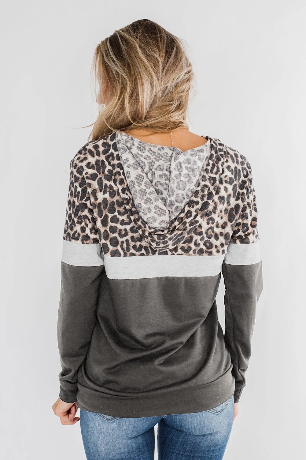 Into the Jungle Color Block Hoodie featuring a leopard design, lightweight fabric, and drawstring hood.