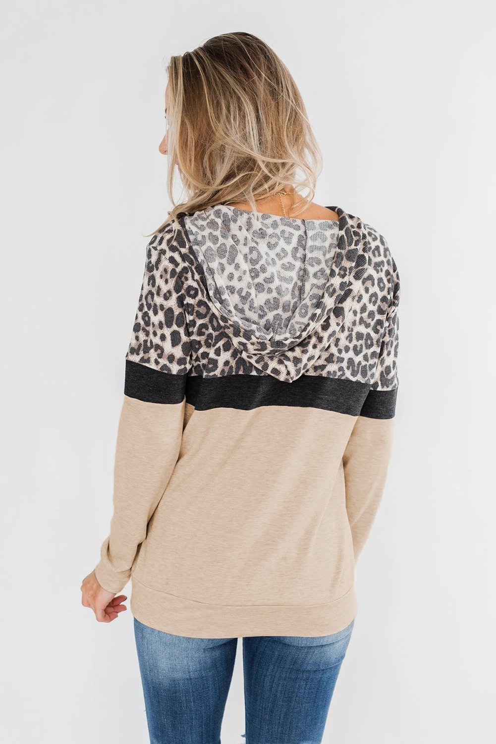 Into the Jungle Color Block Hoodie featuring a leopard design, lightweight fabric, and drawstring hood.