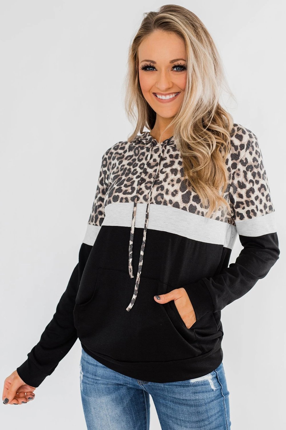 Into the Jungle Color Block Hoodie featuring a leopard design, lightweight fabric, and drawstring hood.