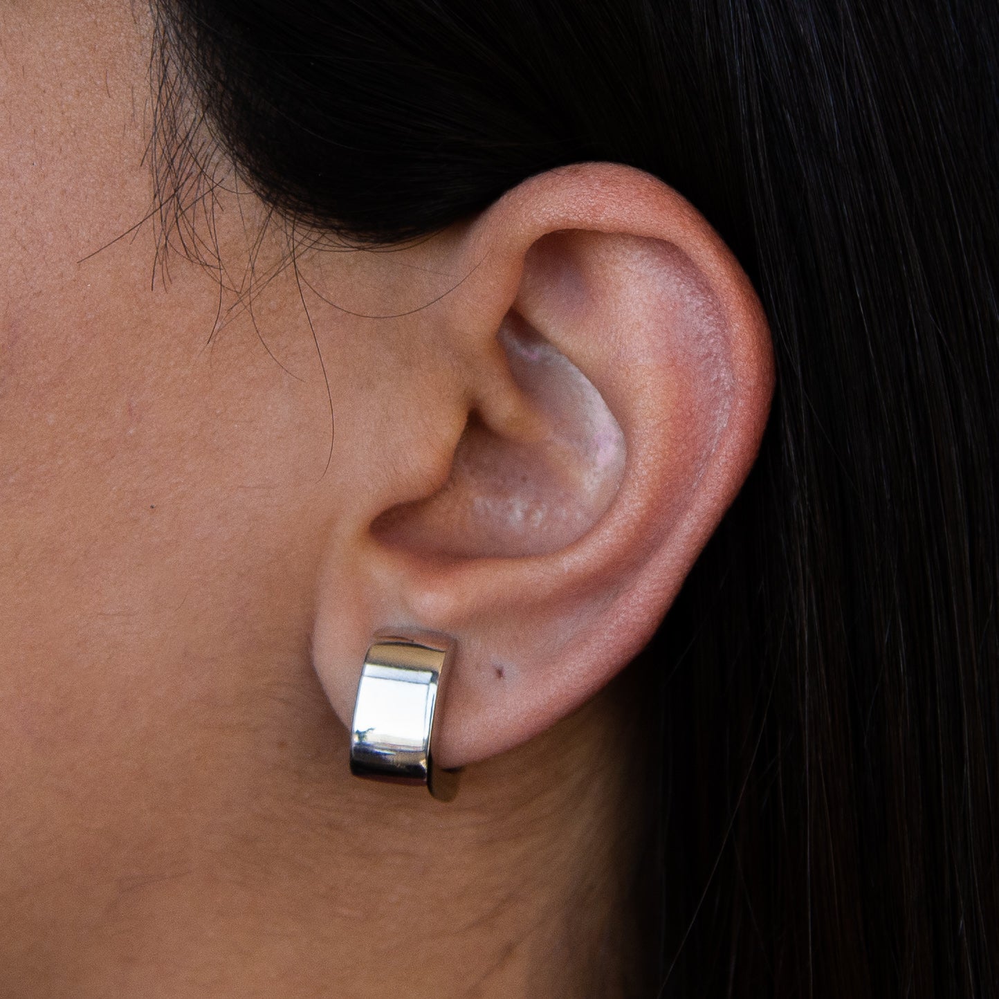 Elegant Italian Sterling Silver Square Hoop Earrings showcasing a modern design with a polished finish.