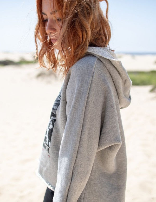 Cropped Janis Joplin hoodie in heathered gray with graphic print, featuring raw baseball hem and 3/4 sleeves.