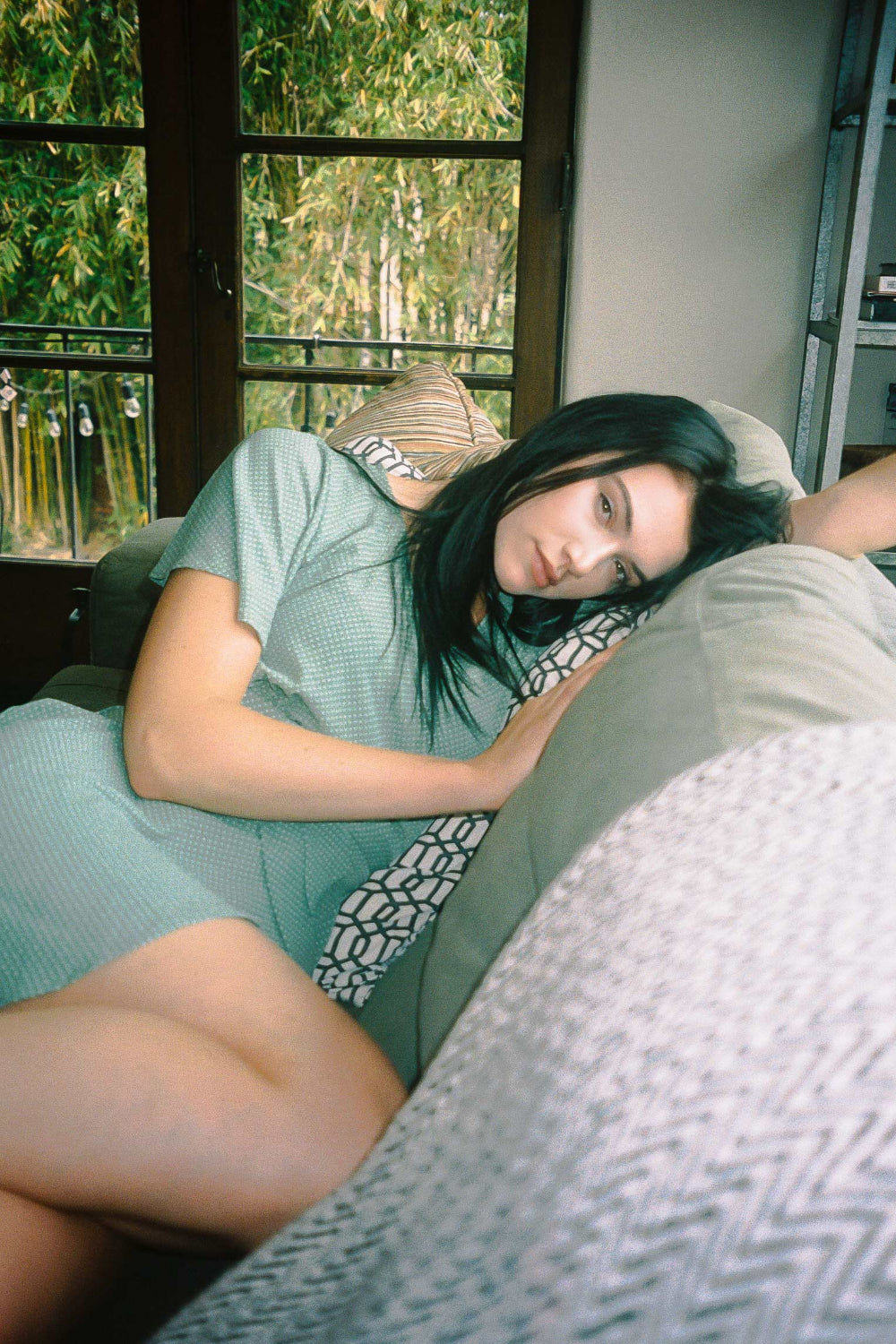 A stylish Julep Wrap Dress featuring white polka dots, flouncy sleeves, and a feminine waist-defining wrap detail, perfect for various occasions.