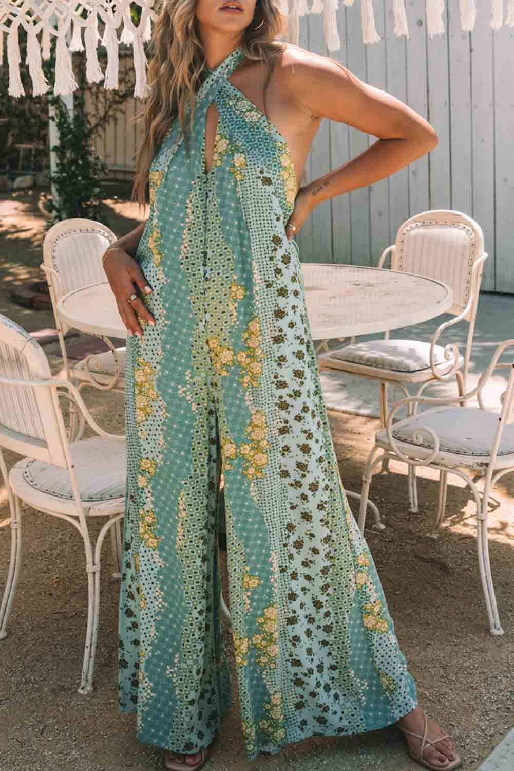 Light blue jumpsuit with fashionable print, featuring sleeveless design and open back, perfect for casual outings.