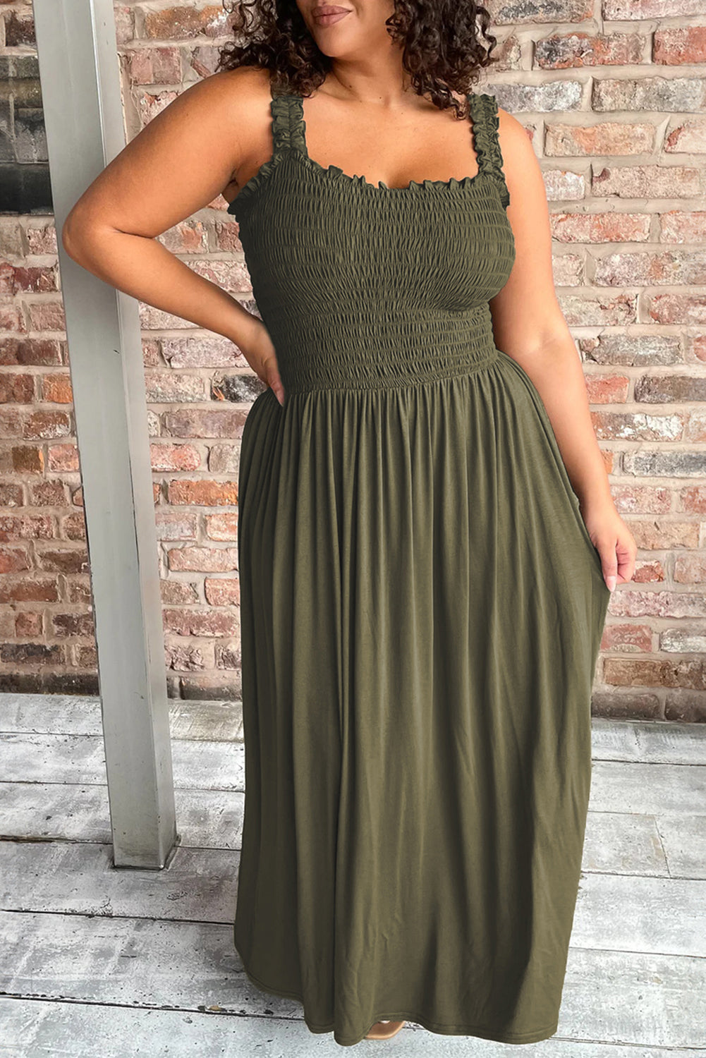 Jungle Green Shirred Bust Sleeveless Plus Size Maxi Dress displayed on a mannequin, showcasing its flattering silhouette and vibrant color.