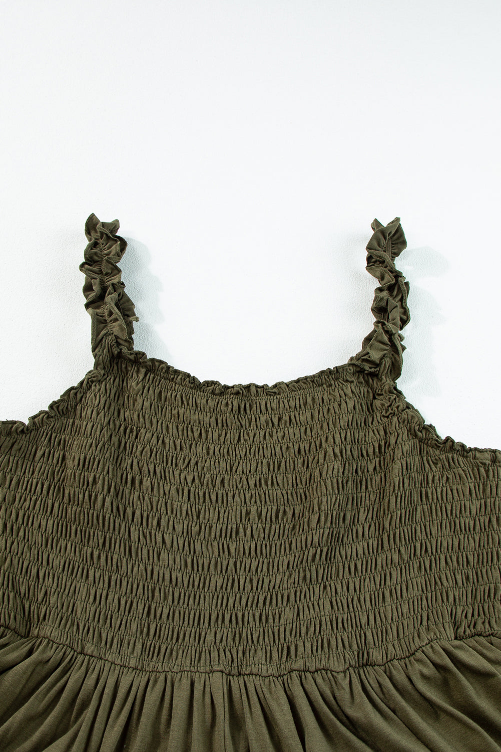 Jungle Green Shirred Bust Sleeveless Plus Size Maxi Dress displayed on a mannequin, showcasing its flattering silhouette and vibrant color.