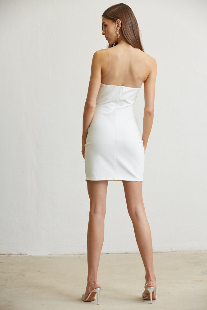 The Kennedy dress featuring a bodycon fit, sheer mesh bodice panels, and pearl bead embellishments at the hip, perfect for elegant occasions.