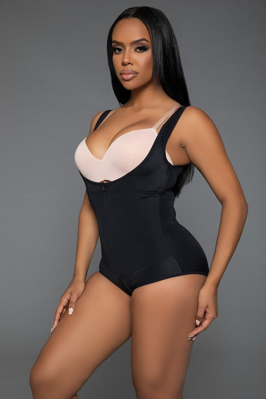 Keep It Tight Bodysuit Shaper featuring adjustable straps, open bust design, and front zipper closure, made from stretchy nylon and spandex fabric.