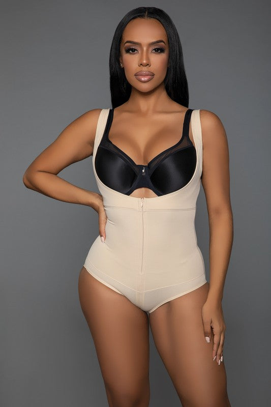 Keep It Tight Bodysuit Shaper featuring adjustable straps, open bust design, and front zipper closure, made from stretchy nylon and spandex fabric.