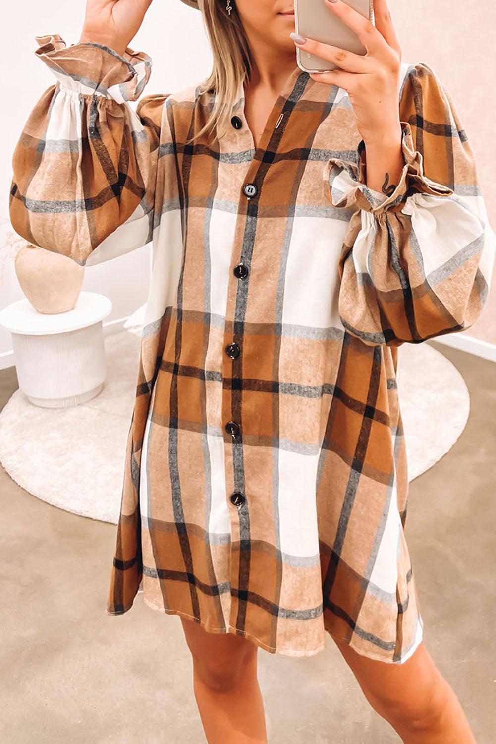 A stylish khaki plaid shirt dress featuring a collared neck and ruffled sleeves, perfect for autumn fashion.