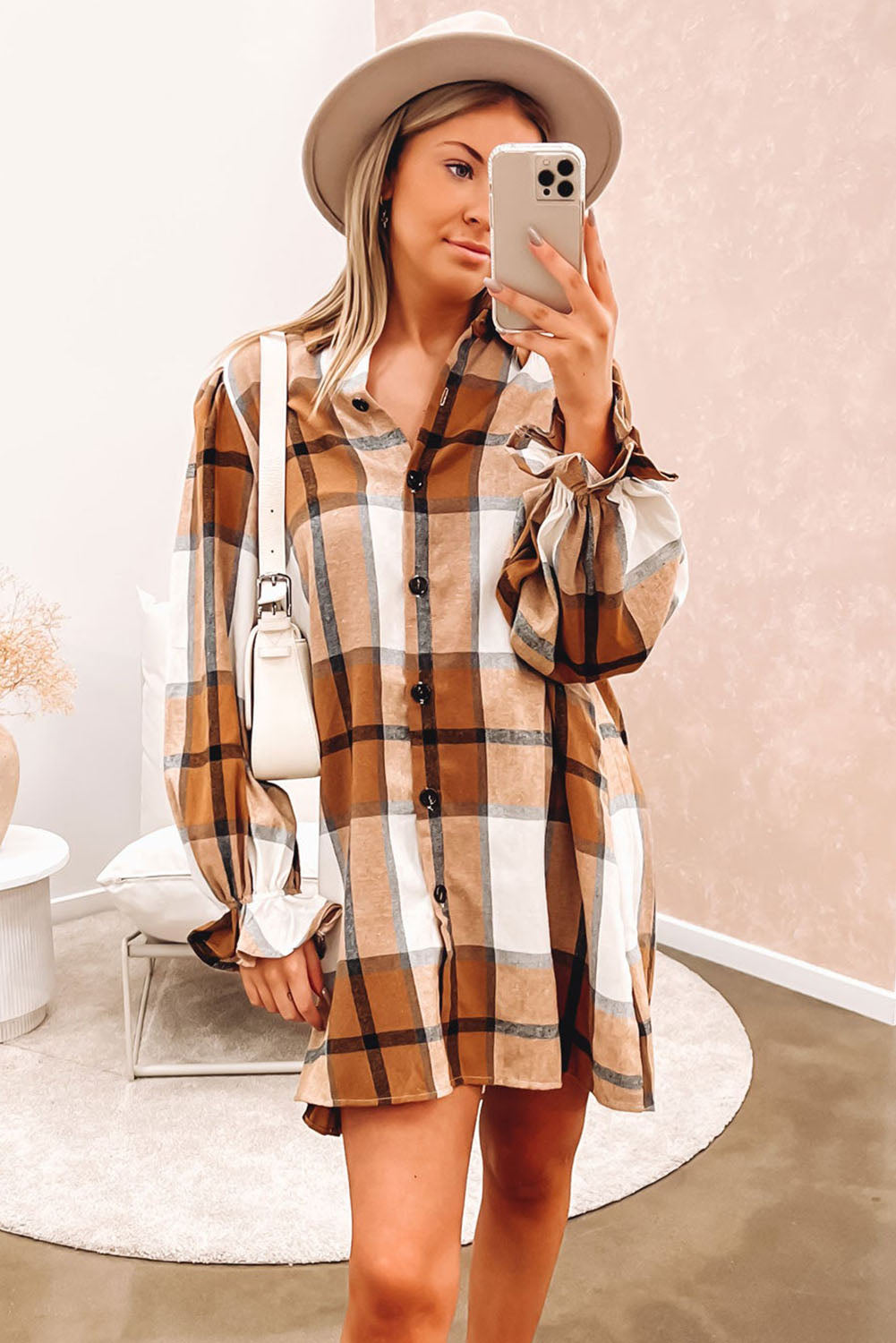 A stylish khaki plaid shirt dress featuring a collared neck and ruffled sleeves, perfect for autumn fashion.