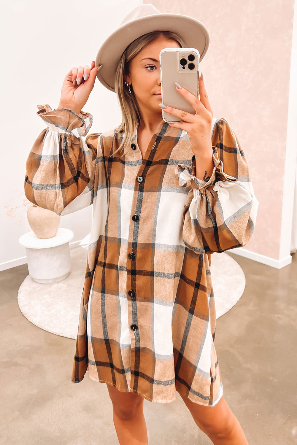 A stylish khaki plaid shirt dress featuring a collared neck and ruffled sleeves, perfect for autumn fashion.