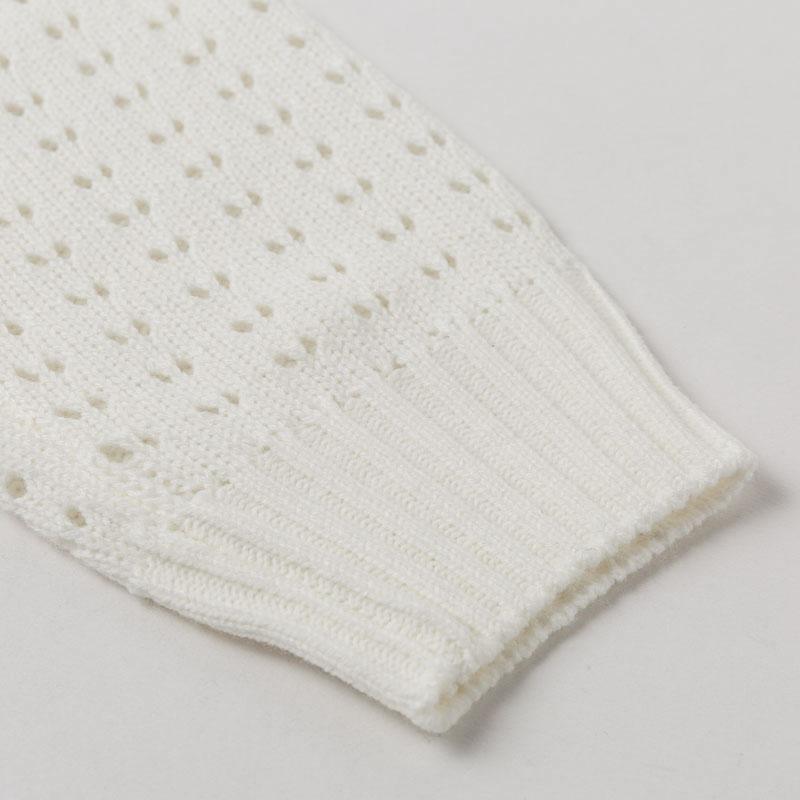 A stylish backless knitted pullover for women with long sleeves and an O-neck design, perfect for clubbing or casual outings.