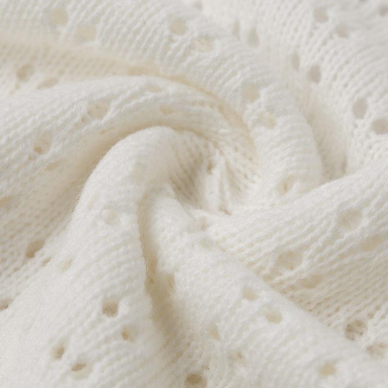 A stylish backless knitted pullover for women with long sleeves and an O-neck design, perfect for clubbing or casual outings.