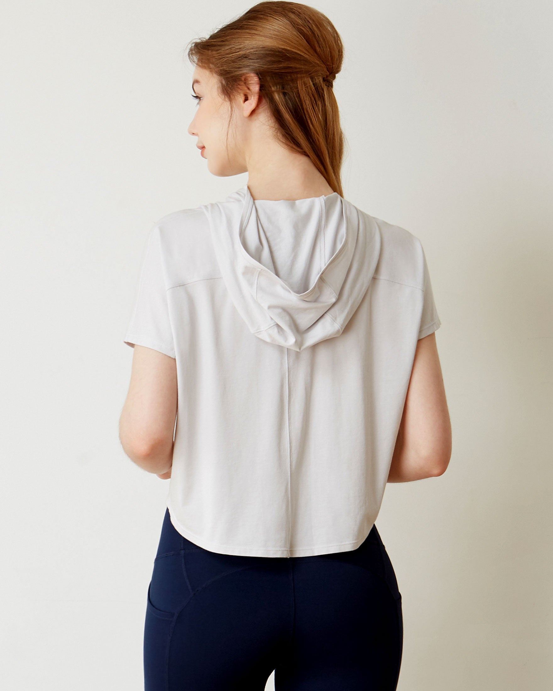 A stylish Knot Your Race Hoodie in a soft pima cotton/modal blend, showcasing its versatile design and comfortable fit.