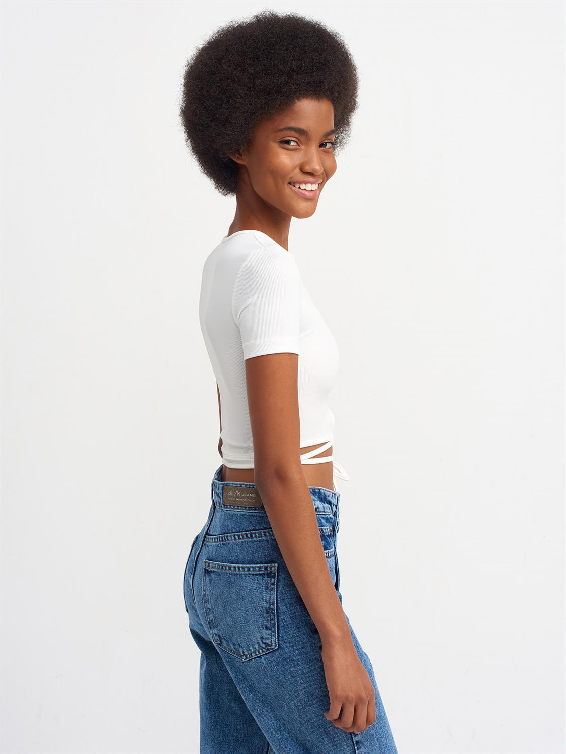 A stylish Lace Up Crop Top featuring a chic lace-up front design, made from a comfortable nylon-elastane blend.