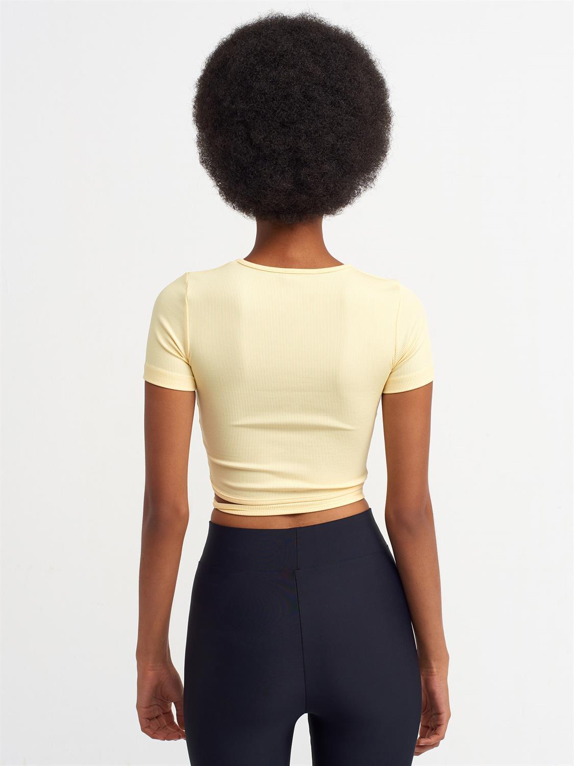 A stylish Lace Up Crop Top featuring a chic lace-up front design, made from a comfortable nylon-elastane blend.