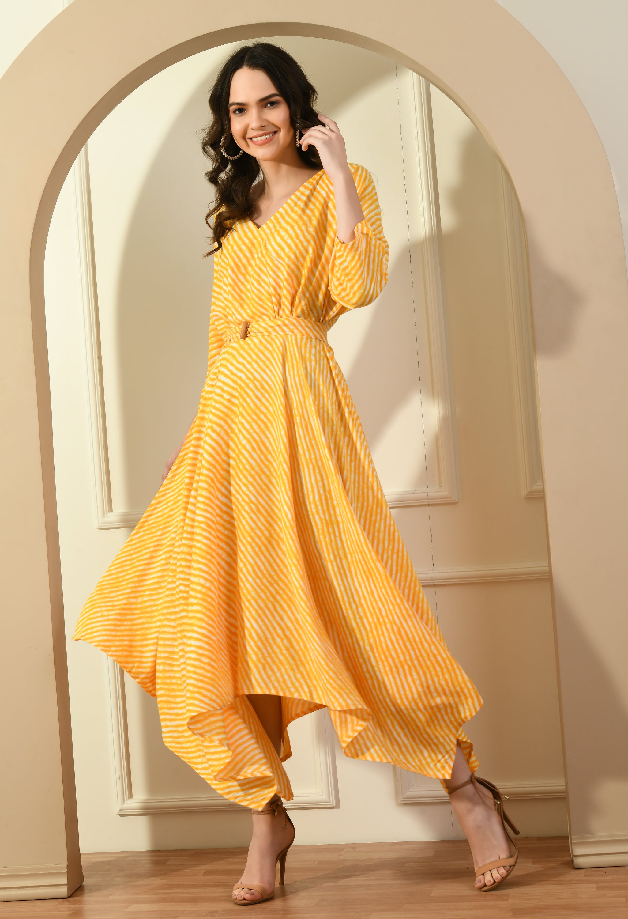 Leheria Zig Zag Dress in vibrant yellow with a detachable belt and asymmetrical hem, styled on a model.