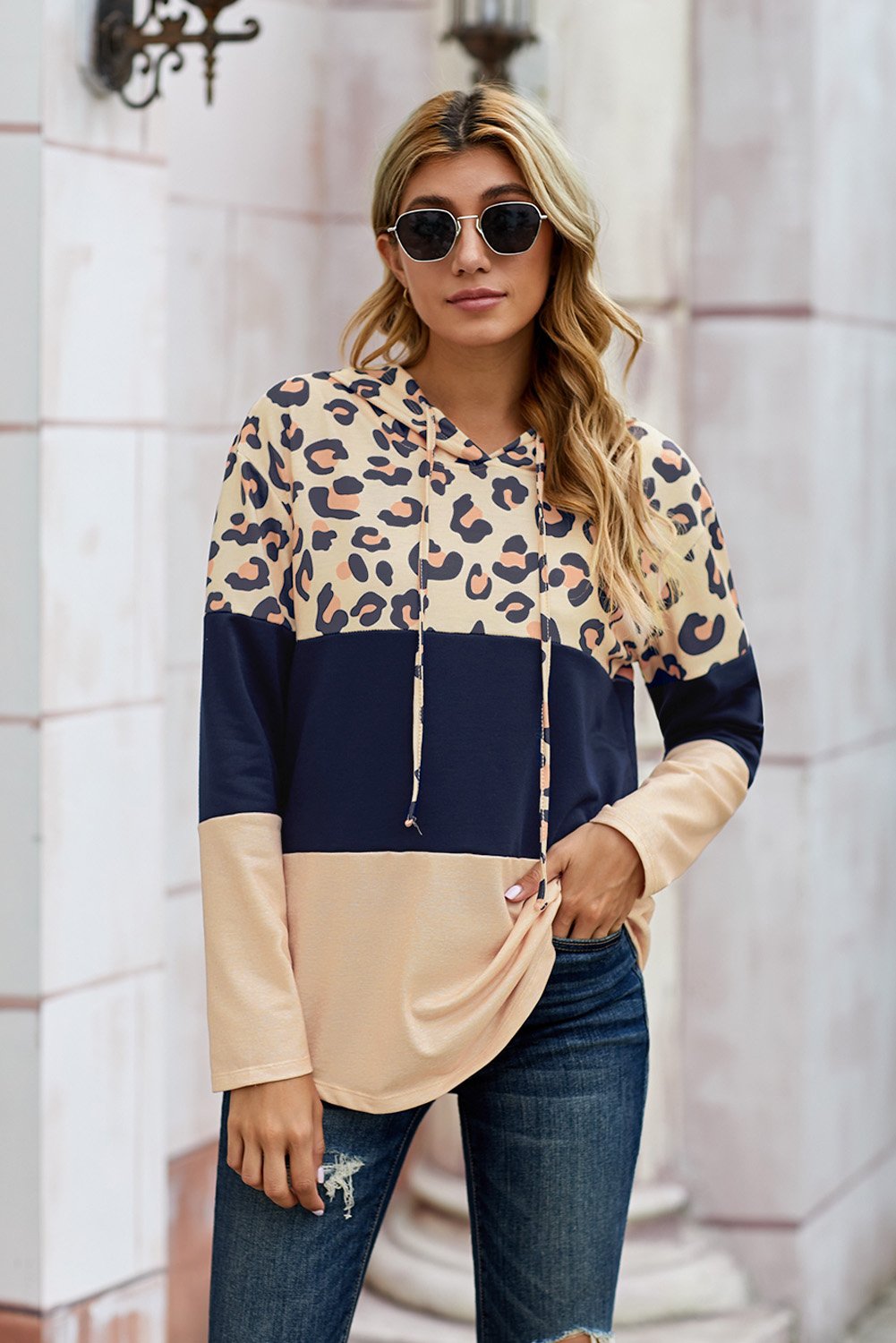 Leopard Color Block Drawstring Hoodie featuring a stylish design with triple color stitching and a chic leopard print.