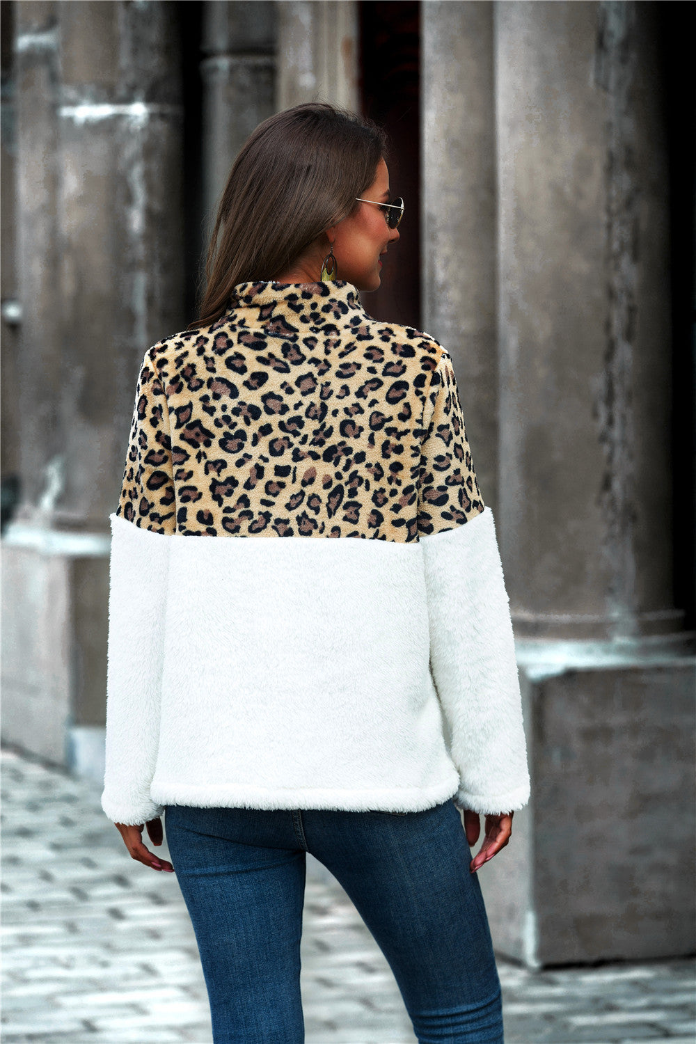 Leopard Color Block Half-Zip Collar Teddy Sweatshirt displayed outdoors, showcasing its stylish design and cozy fabric.