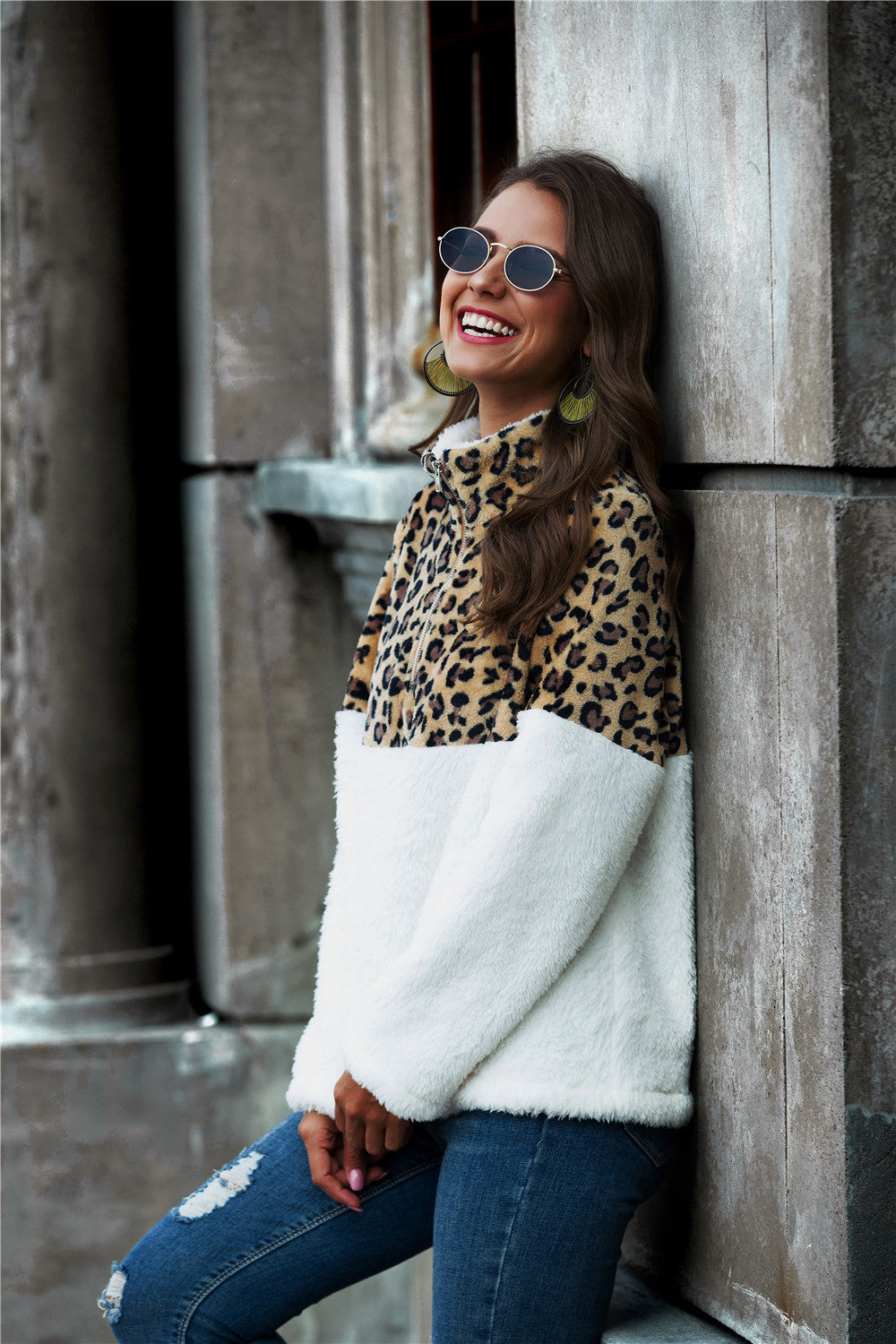Leopard Color Block Half-Zip Collar Teddy Sweatshirt displayed outdoors, showcasing its stylish design and cozy fabric.