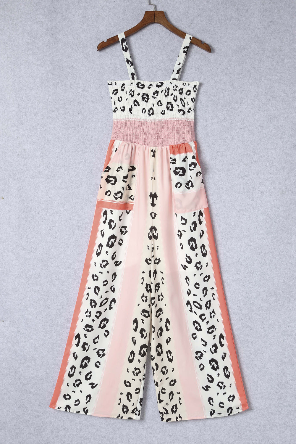 Leopard Color Block Smocked Jumpsuit featuring a stylish design with pockets and a sleeveless fit.