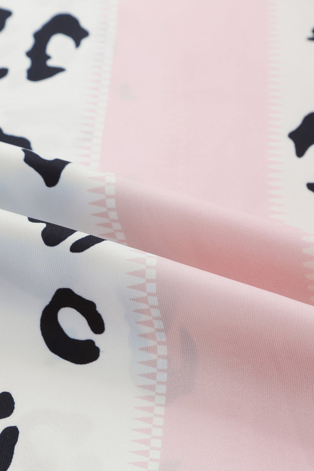 Leopard Color Block Smocked Jumpsuit featuring a stylish design with pockets and a sleeveless fit.