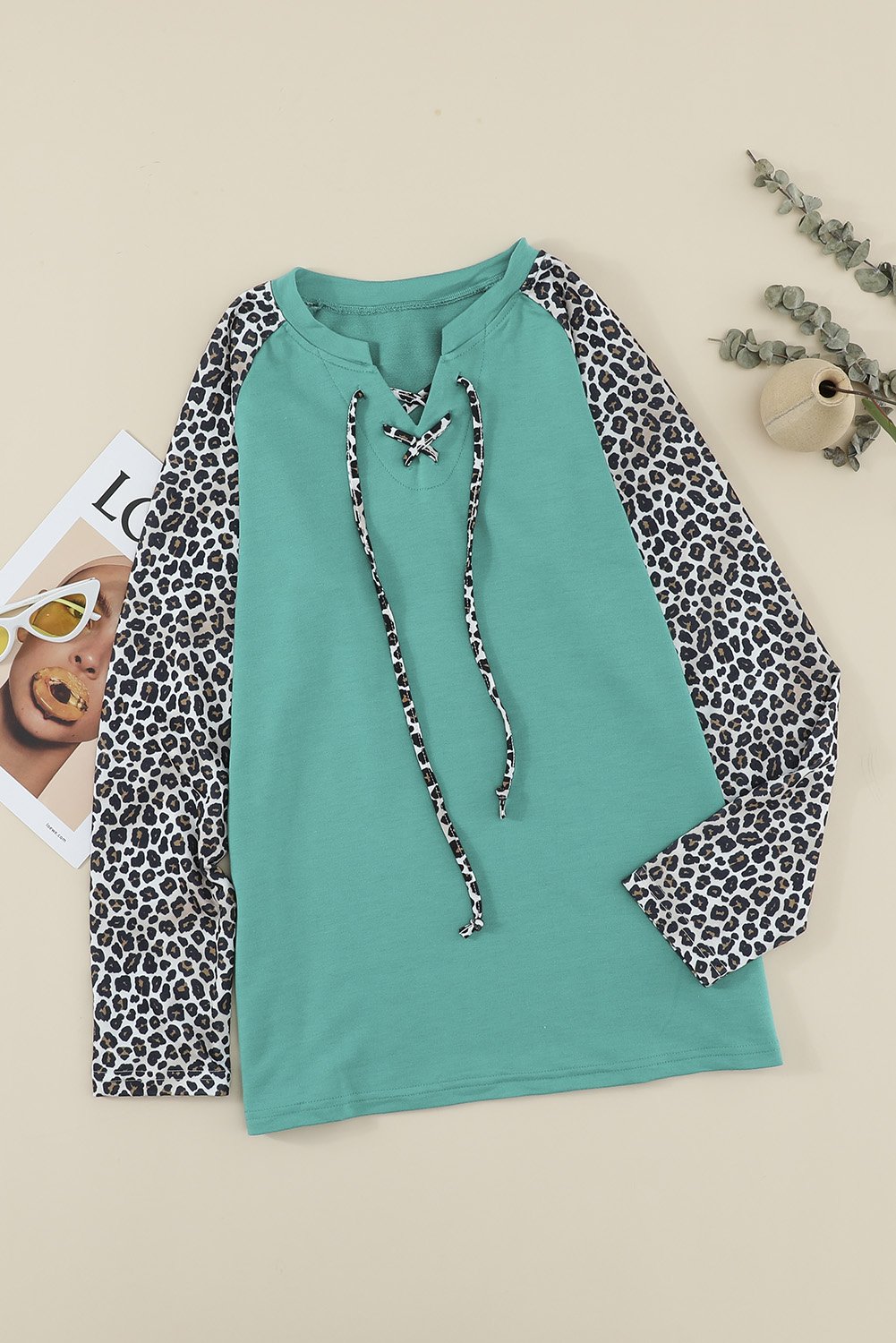 Leopard Patchwork Lace-up Front Long Sleeve Top featuring a stylish lace-up neckline and relaxed fit, perfect for casual wear.