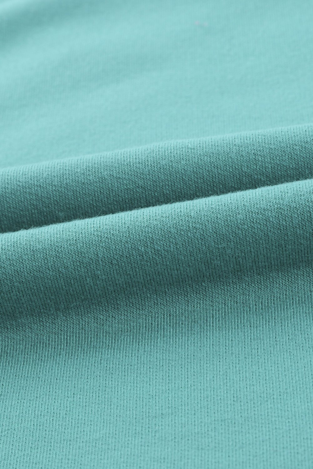 Leopard Patchwork Lace-up Front Long Sleeve Top featuring a stylish lace-up neckline and relaxed fit, perfect for casual wear.