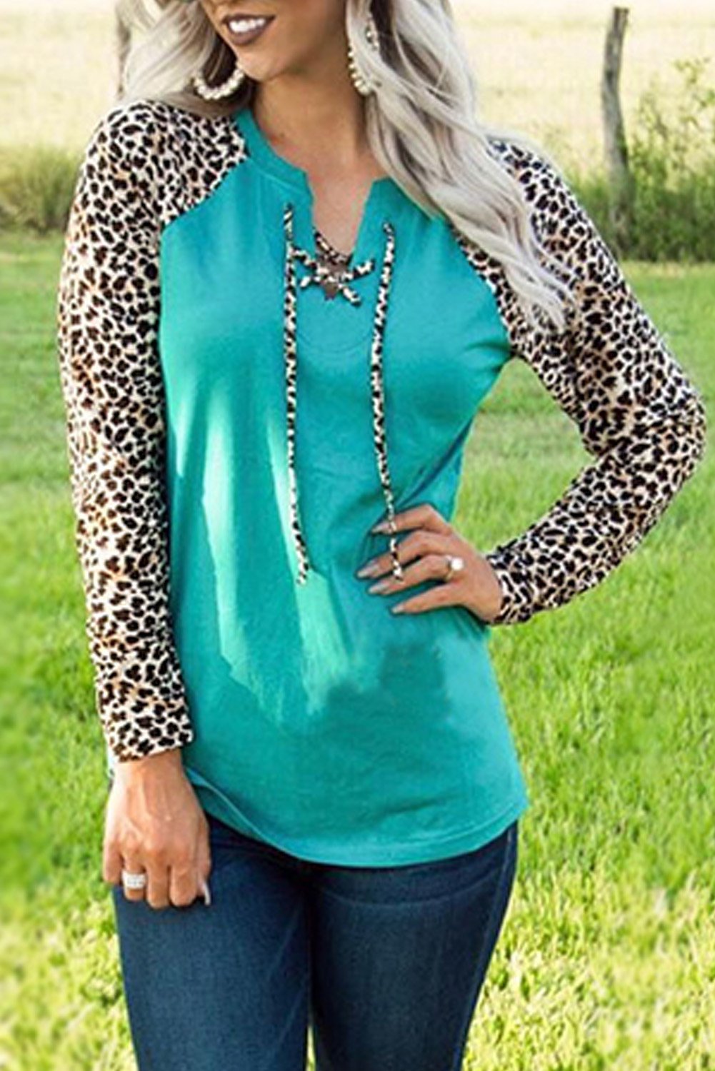 Leopard Patchwork Lace-up Front Long Sleeve Top featuring a stylish lace-up neckline and relaxed fit, perfect for casual wear.