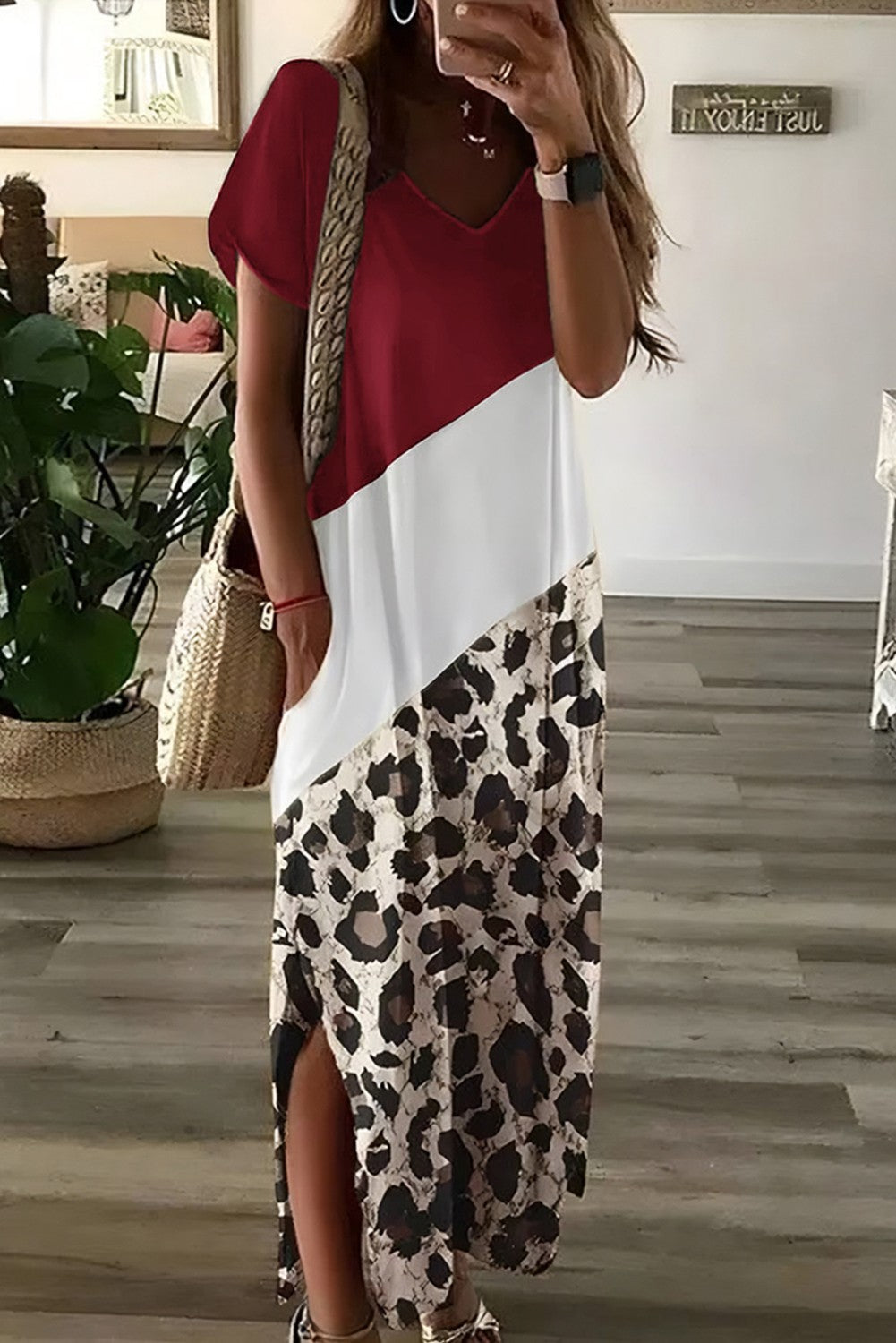 A red leopard print elegant maxi dress featuring a deep neckline, short sleeves, and a side slit, perfect for stylish occasions.