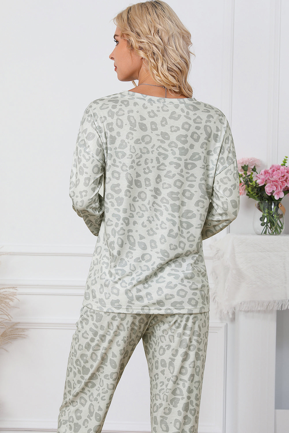 Leopard print long sleeve top paired with drawstring joggers, showcasing a stylish and cozy loungewear set for women.